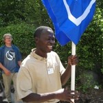 Professor takes a turn holding the banner